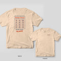 Ivory Comfort Colors tee shown back and front: a wall calendar with every month circled on the back and a circled Shrimp Season script on the left chest.