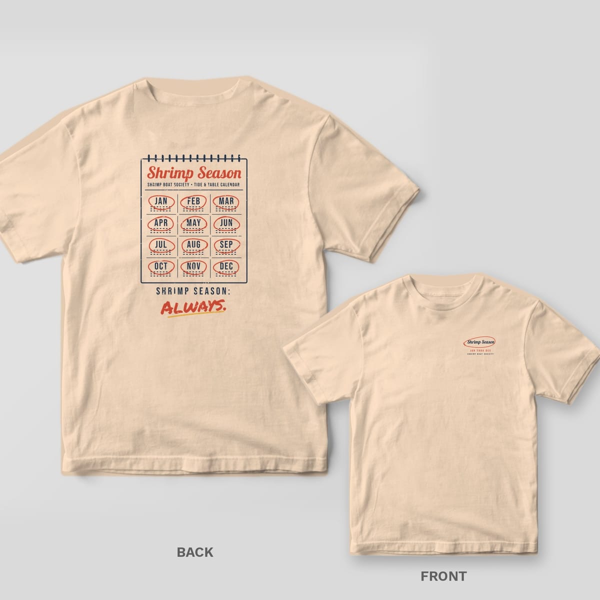 Ivory Comfort Colors tee shown back and front: a wall calendar with every month circled on the back and a circled Shrimp Season script on the left chest.
