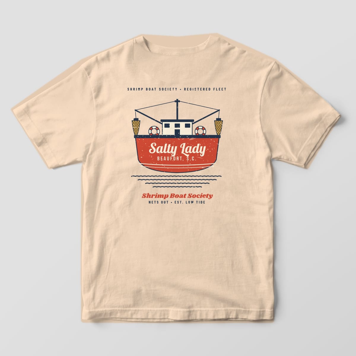 Back of an Ivory Comfort Colors 1717 tee with a red trawler transom with the sample boat name Salty Lady and home port Beaufort S.C., outriggers and nets above.