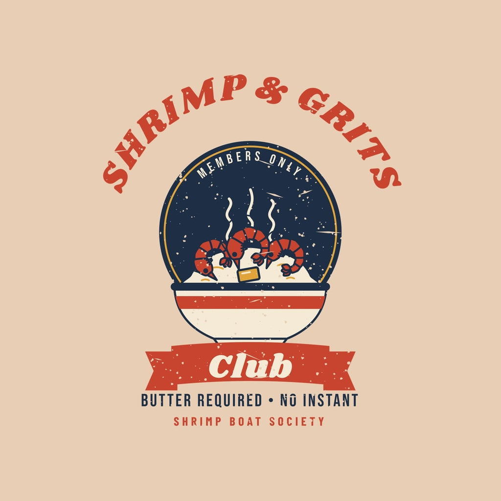 Close-up of the Shrimp and Grits Club print: red arched lettering, navy badge, shrimp on grits and butter-required tagline