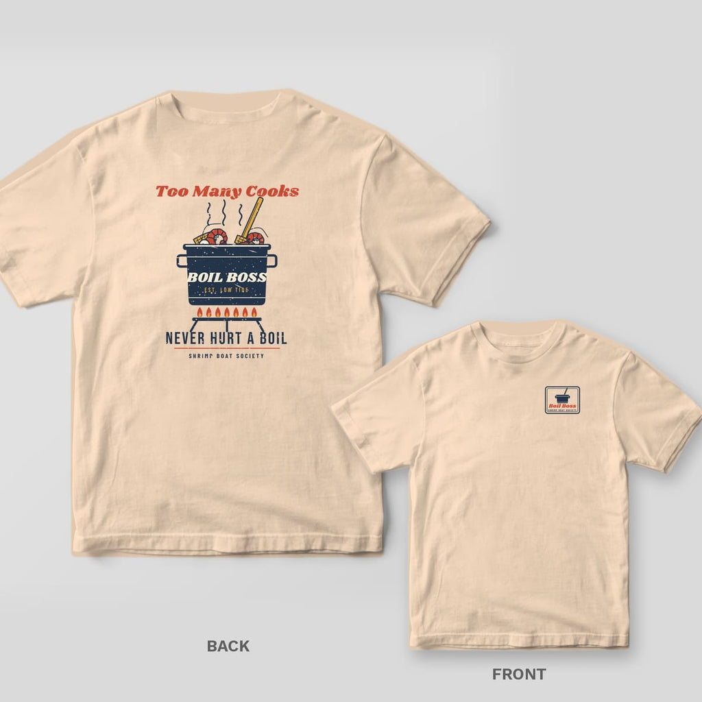 Ivory Comfort Colors tee back with a boil pot full of shrimp and corn and Too Many Cooks Never Hurt a Boil text, with the Boil Boss pocket stamp inset