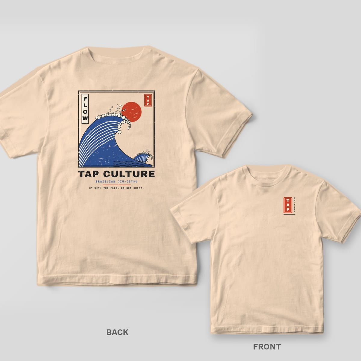Ivory Comfort Colors tee shown back and front: framed blue great wave with red sun and FLOW on the back, small red TAP seal on the left chest.