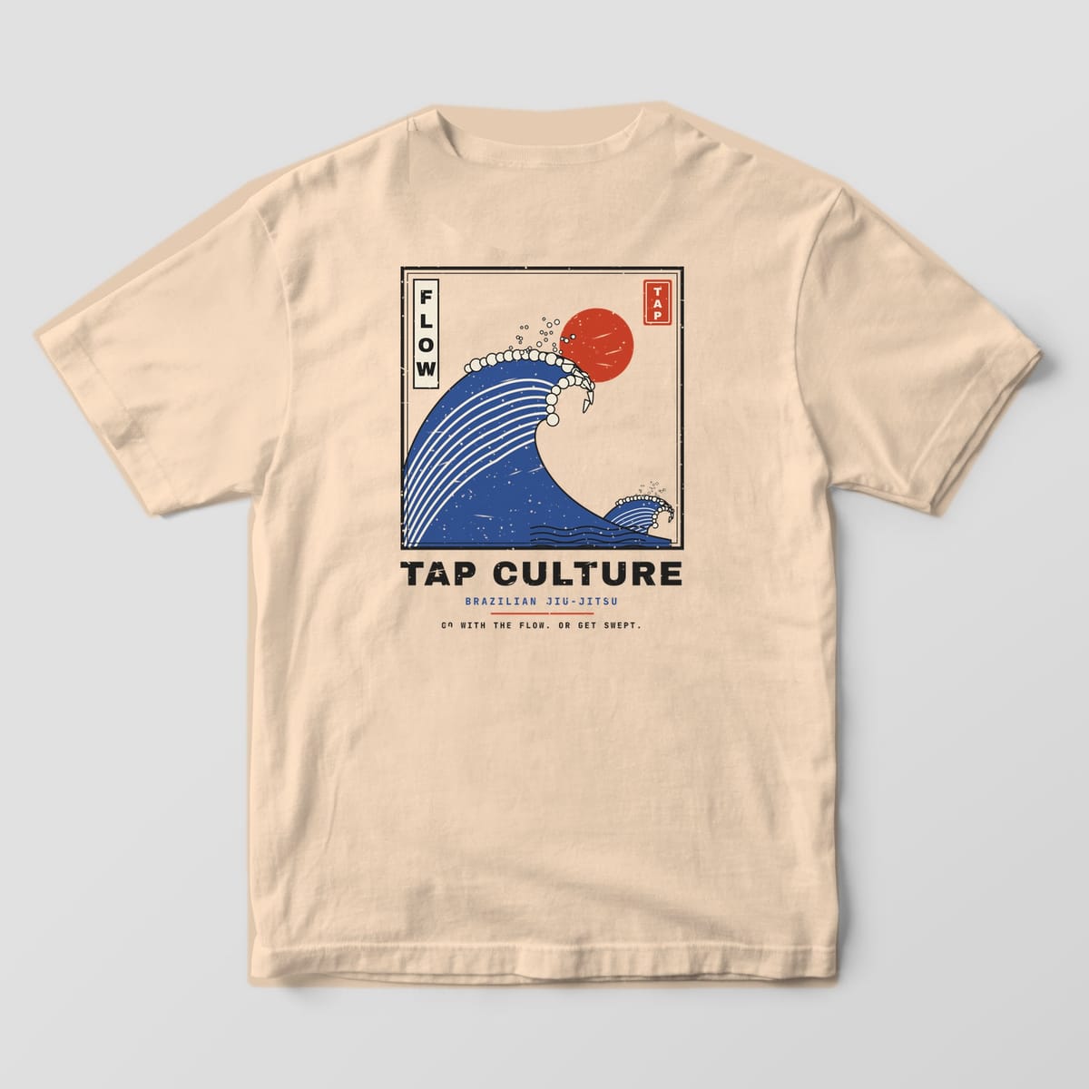 Back of an ivory Comfort Colors 1717 tee with a framed blue woodblock wave, red sun, FLOW cartouche and TAP CULTURE lettering.
