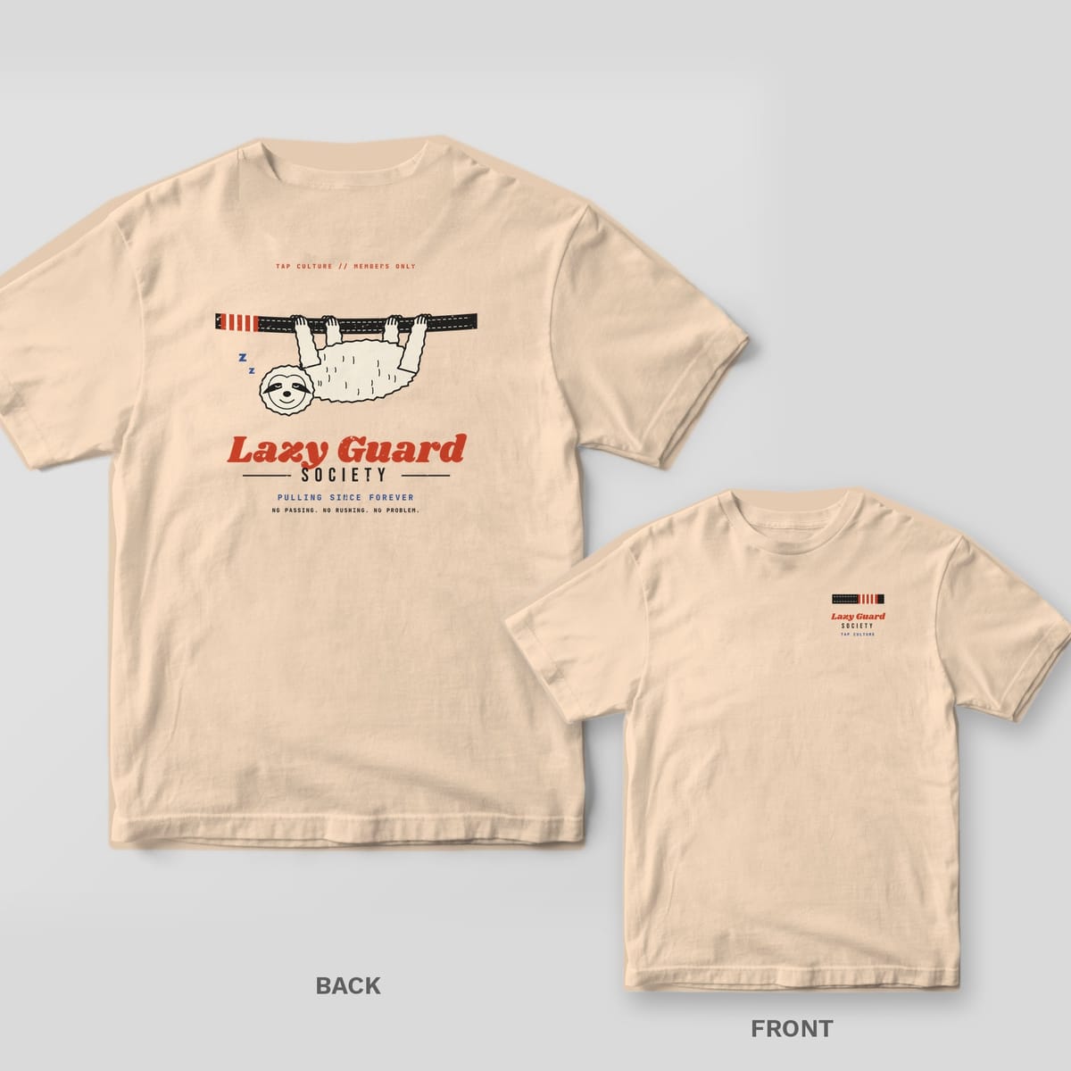 Ivory Comfort Colors tee, back and front: smiling sloth hanging from a black belt over Lazy Guard Society, belt bar logo on the chest.