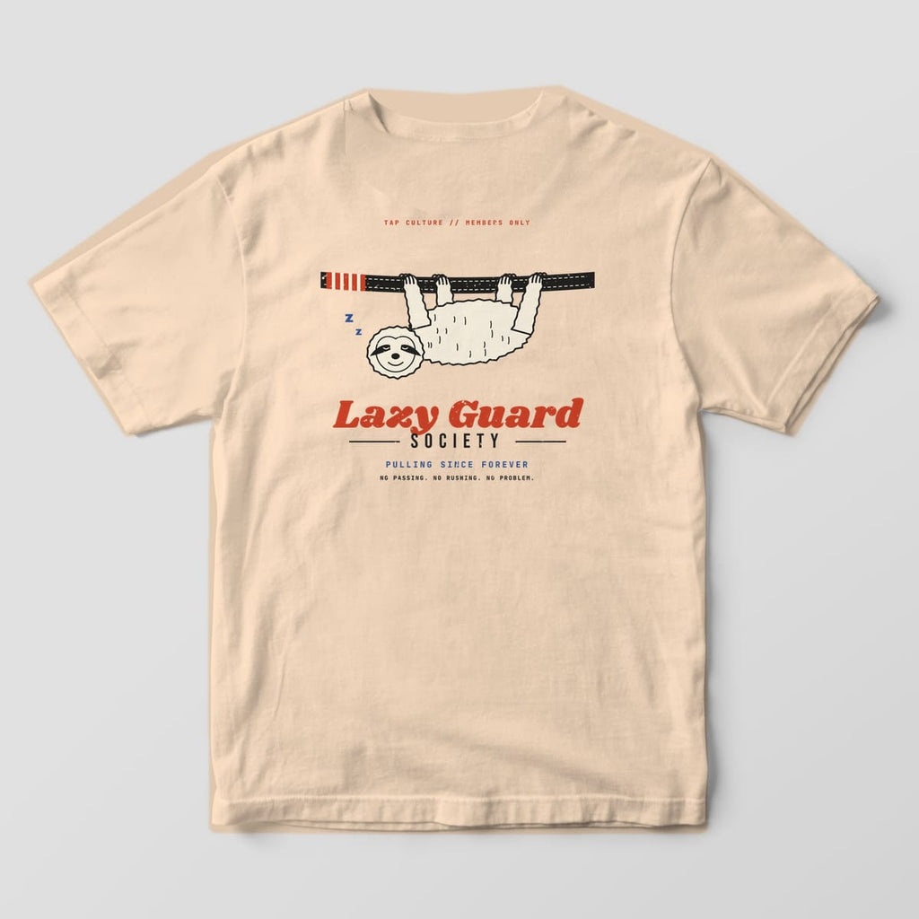 Back of an ivory Comfort Colors 1717 tee with a cream sloth hanging from a black belt and red Lazy Guard lettering.