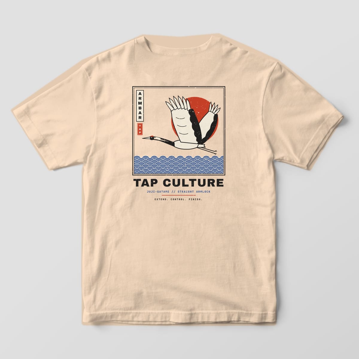 Back of an ivory Comfort Colors 1717 tee with a black and cream crane, red rising sun and blue seigaiha sea in a square frame.