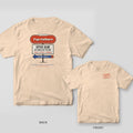 Ivory tee shown back and front: retro diner sign reading Tap Culture, Open 6AM, No Shoes on the Mat on the back, red TAPPED OUT stamp on the chest.