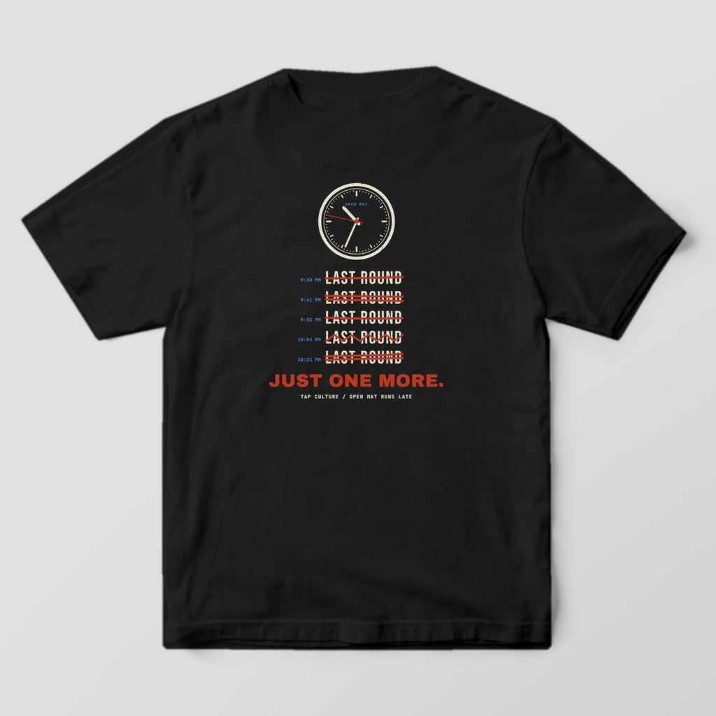 Back of a black Comfort Colors 1717 tee with a cream wall clock, five red-struck LAST ROUND lines and Just One More.