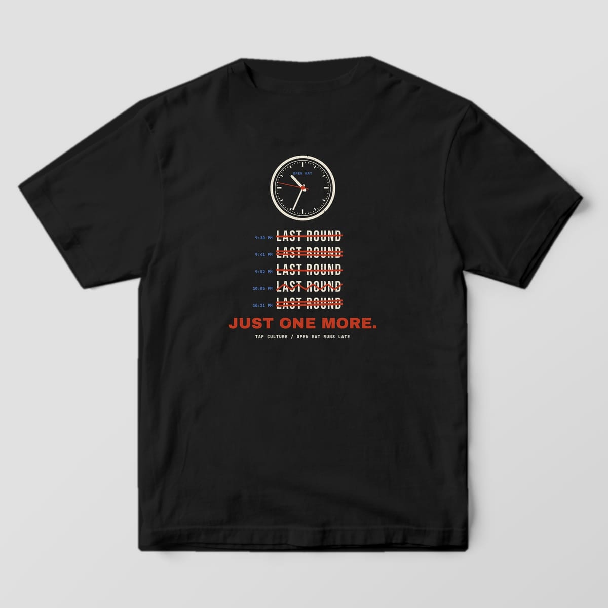 Back of a black Comfort Colors 1717 tee with a cream wall clock, five red-struck LAST ROUND lines and Just One More.