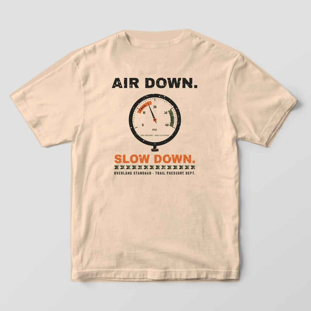 Back of a Ivory Comfort Colors 1717 tee with a black tire pressure dial, orange trail zone and the words Air Down. Slow Down.