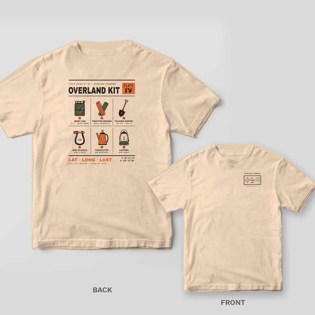 Ivory Comfort Colors tee shown back and front: a field guide page of six numbered overland gear items on the back and a small coordinate stamp on the chest.