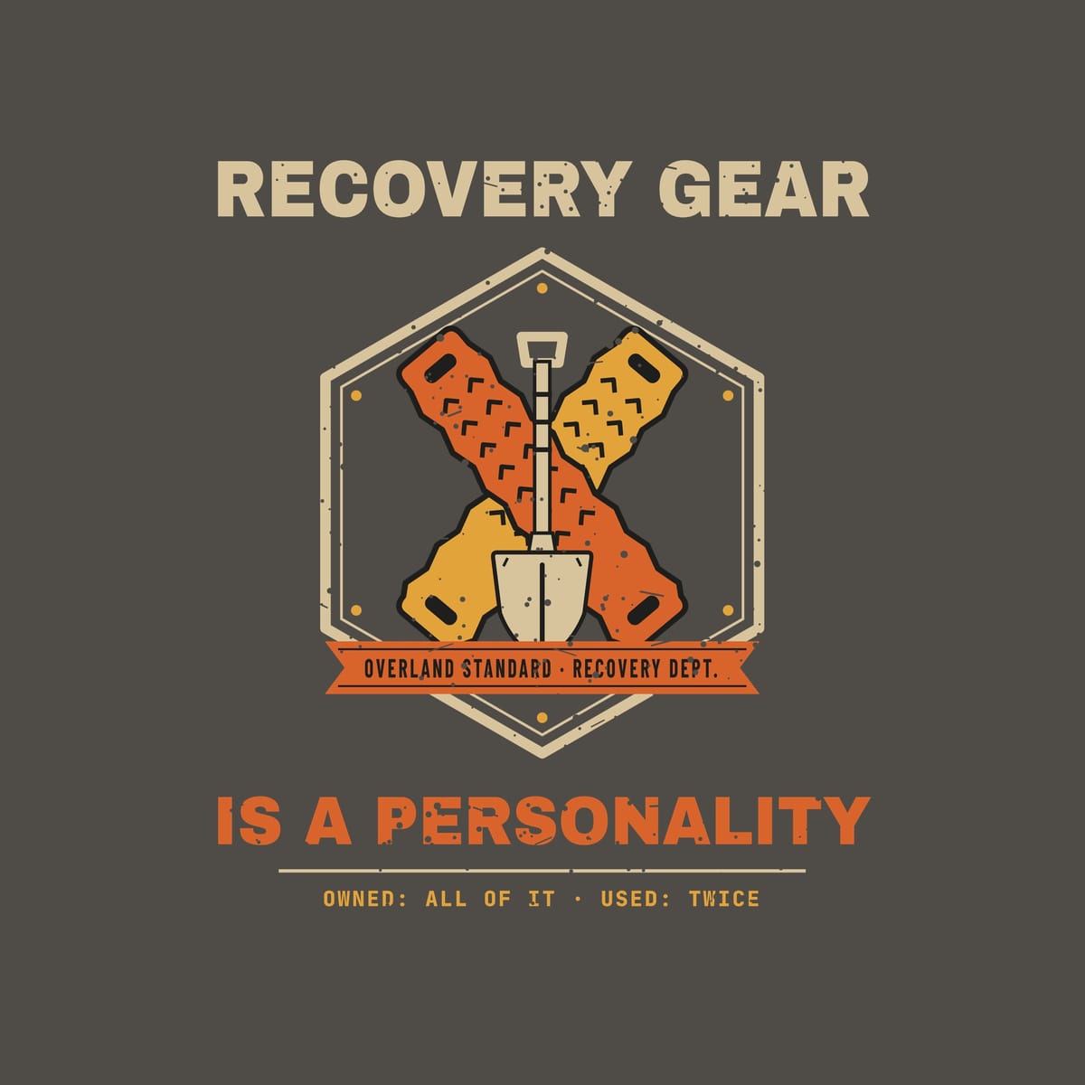 Close-up of the recovery badge print: sawtooth traction boards with chevron cleats, sand shovel, orange banner and distressed type.