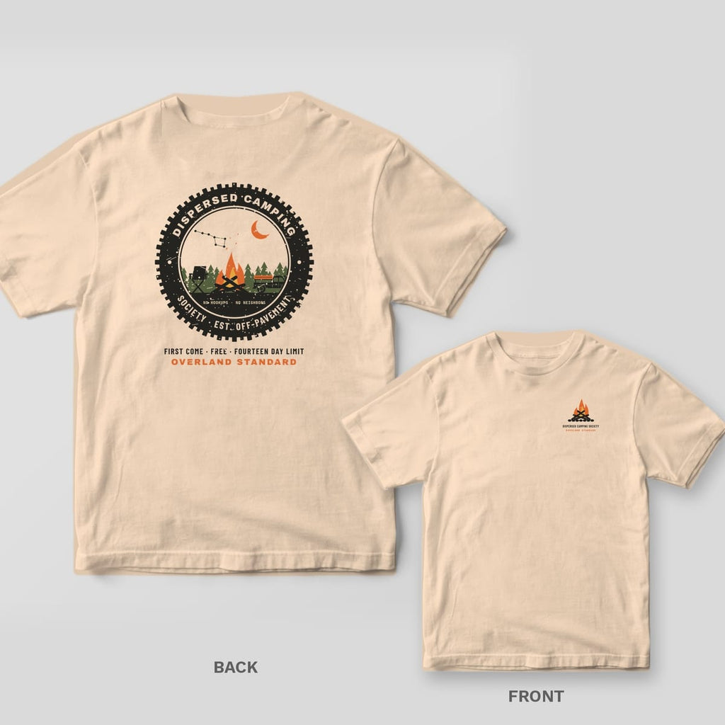 Ivory Comfort Colors tee shown back and front: a round tire-tread campfire patch reading Dispersed Camping Society on the back and a small campfire on the chest.