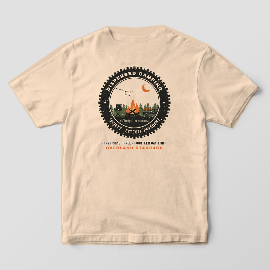 Back of a Ivory Comfort Colors 1717 tee with a tire-tread badge around a campfire, camp chair, rooftop-tent truck and pine trees, reading Dispersed Camping Society.