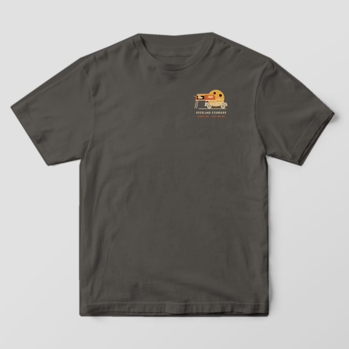 Front of a Pepper Comfort Colors 1717 tee with a small rooftop-tent truck and moon icon and the words Overland Standard.