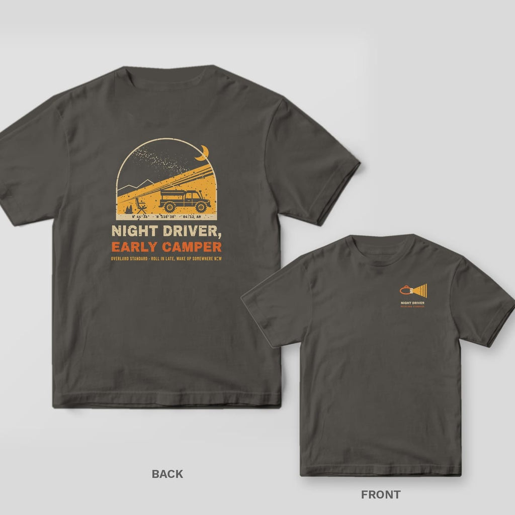 Back and front of a pepper Comfort Colors T-shirt with an arched night camp scene with a headlamp beam lighting a rooftop tent truck under the Milky Way and the words Night Driver, Early Camper; small chest print on the front