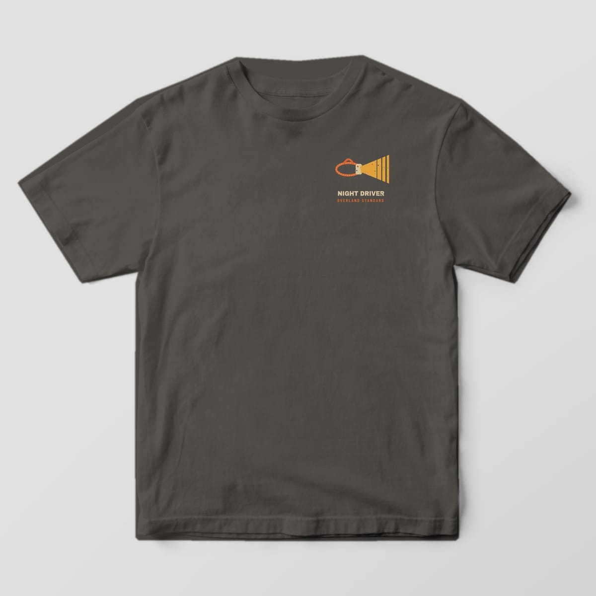 Front of a pepper Comfort Colors 1717 T-shirt with a small left-chest print