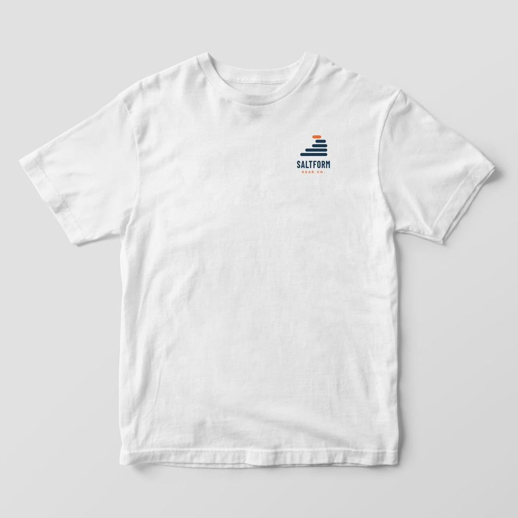Front of a white Comfort Colors 1717 tee with a small navy and orange layer-wave logo and SALTFORM GEAR CO. on the left chest.