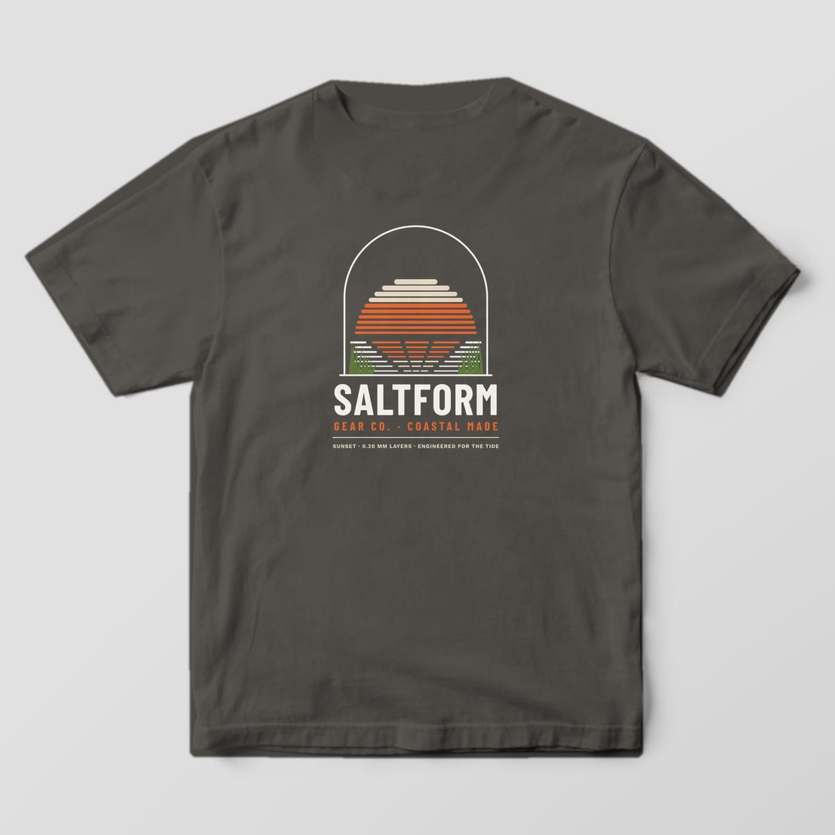Back of a pepper gray Comfort Colors 1717 tee with a sand and orange layer-line sunset over water and marsh grass inside an arch.