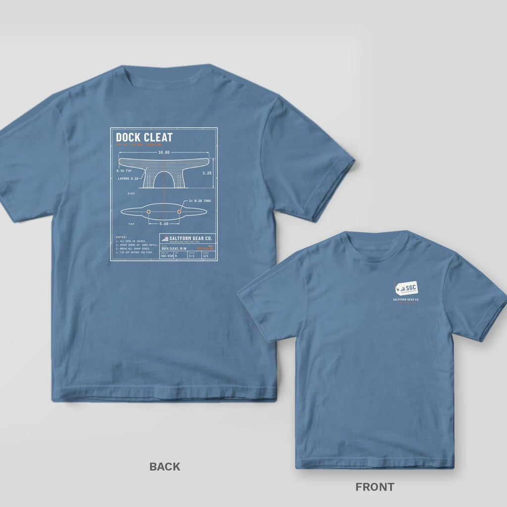 Blue jean Comfort Colors tee back and front: cream dock cleat blueprint with title block on the back, SGC gear tag on the chest.