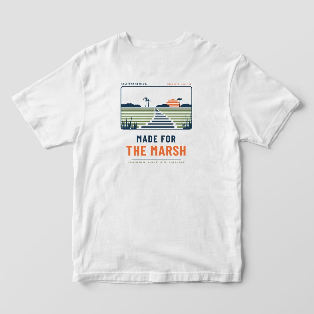 Back of a white Comfort Colors 1717 tee with a salt marsh scene in navy, green and orange layer lines over MADE FOR THE MARSH.