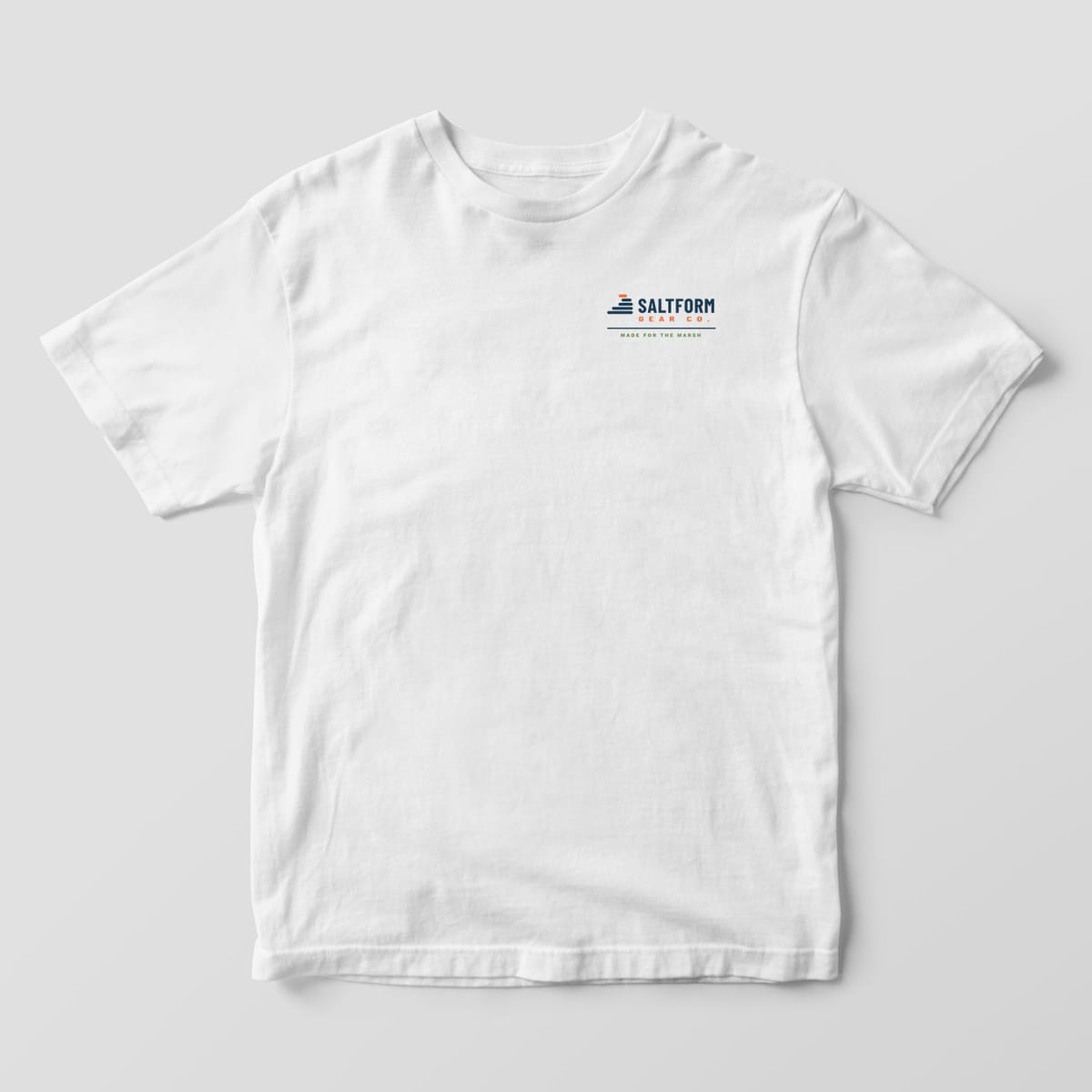 Front of a white Comfort Colors 1717 tee with the horizontal Saltform Gear Co. wordmark on the left chest.