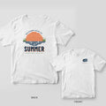 White Comfort Colors tee back and front: orange layered sunset over marsh and SUMMER on the back, SGC gear tag on the chest.