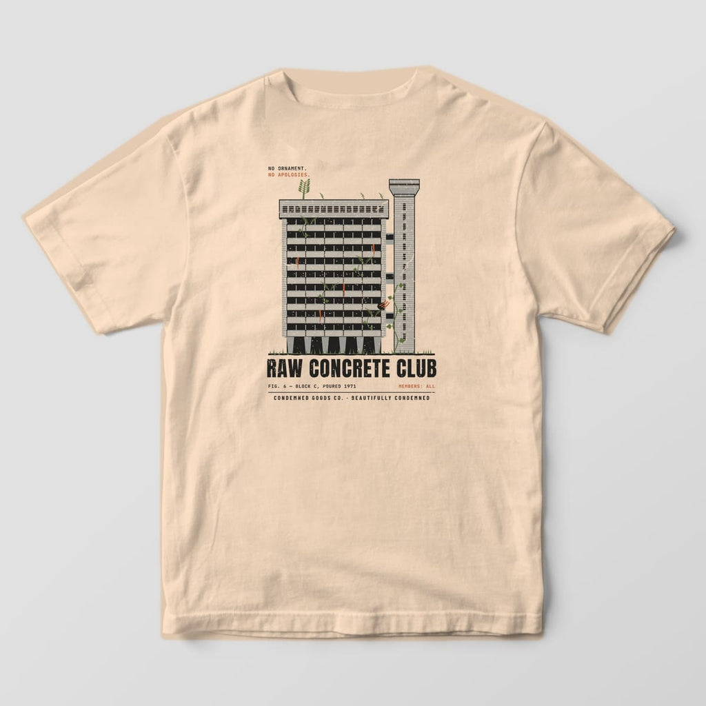 Back of an ivory Comfort Colors 1717 tee with a brutalist concrete tower print labeled Raw Concrete Club.
