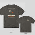 Pepper tee shown back and front: back has a dandelion with a cream seed head and rust flower growing through a sidewalk crack, reading Bloom Where You're Condemned.