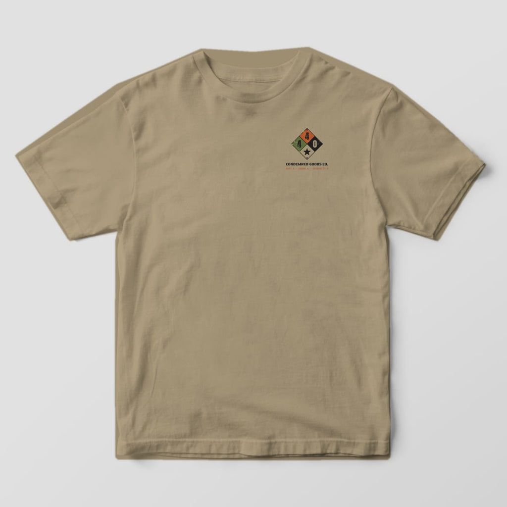 Front of a khaki Comfort Colors 1717 tee with a small four-color hazard diamond on the left chest.