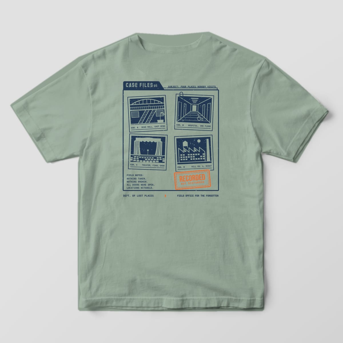 Back of a Bay Comfort Colors 1717 tee printed with a navy case folder holding four photos of a dead mall, hospital hallway, abandoned theater and old mill, with typed field notes and an orange Recorded, Not Disturbed stamp.