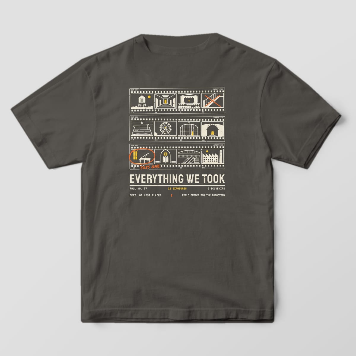 Back of a Pepper Comfort Colors 1717 tee printed with a cream and yellow 35mm contact sheet of twelve abandoned places, one frame circled in orange grease pencil reading This One, above the words Everything We Took.