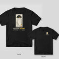 Black Comfort Colors tee shown back and front: the back has a cream elevator panel with a lit yellow B3 button above Next Stop: Unknown; the chest has a small lit B3 button.
