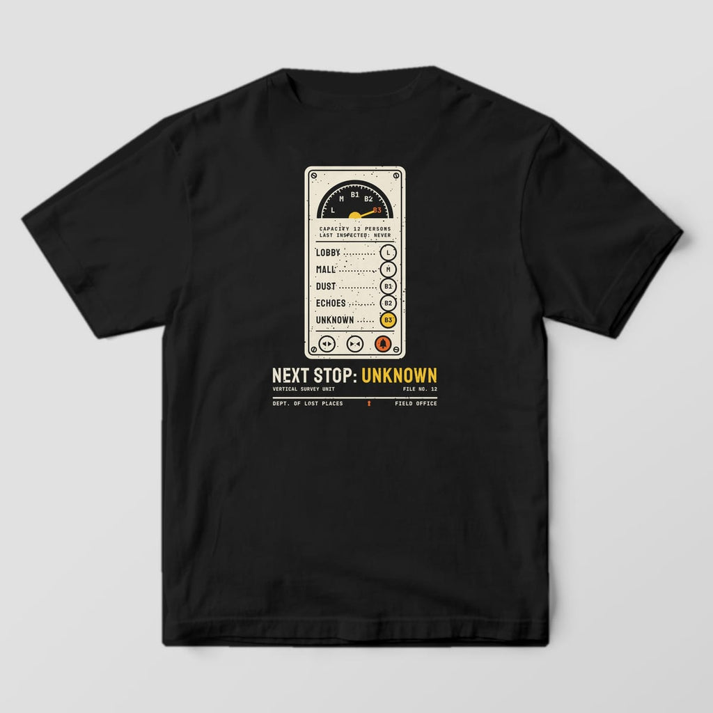 Back of a Black Comfort Colors 1717 tee printed with a cream vintage elevator panel with a floor dial, buttons labeled Lobby, Mall, Dust, Echoes and a lit yellow B3 Unknown button, above Next Stop: Unknown.