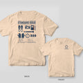 Ivory Comfort Colors tee shown back and front: the back has a navy and orange flat-lay of explorer gear under Standard Issue; the chest has a small compass.