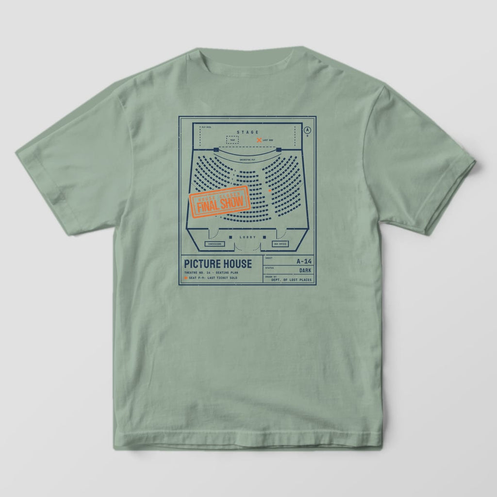 Back of a Bay Comfort Colors 1717 tee printed with a navy architectural seating plan of an old theater with curved rows of seats, a stage and lobby, stamped House Closed, Final Show in orange.