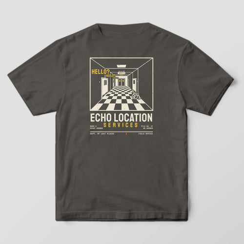 Back of a Pepper Comfort Colors 1717 tee printed with a cream one-point-perspective hospital hallway with a checkered floor, side doors and a wheelchair, with yellow Hello? text echoing down it, above Echo Location Services.