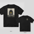 Black Comfort Colors tee shown back and front: the back has a cream brick railway tunnel with a yellow light at the end above The Way Through; the chest has a small tunnel.