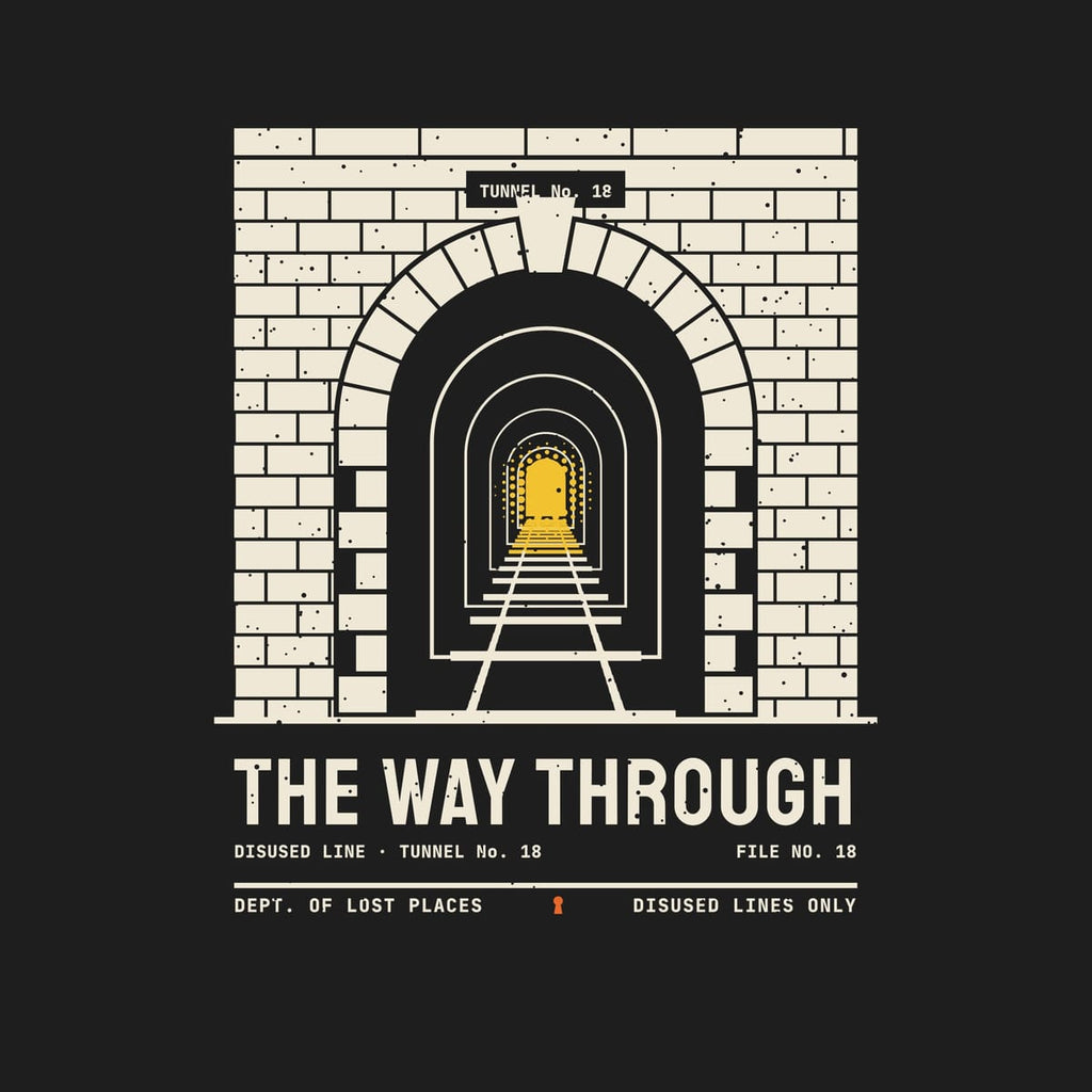 Back print artwork close-up: a cream brick railway tunnel portal with an arched entrance, rails running into the dark and a yellow light at the far end, above the words The Way Through, lightly speckled.