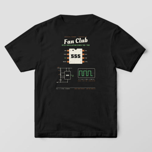 Back of a black Comfort Colors 1717 tee with a 555 timer fan club print, chip pinout, astable schematic and scope trace.