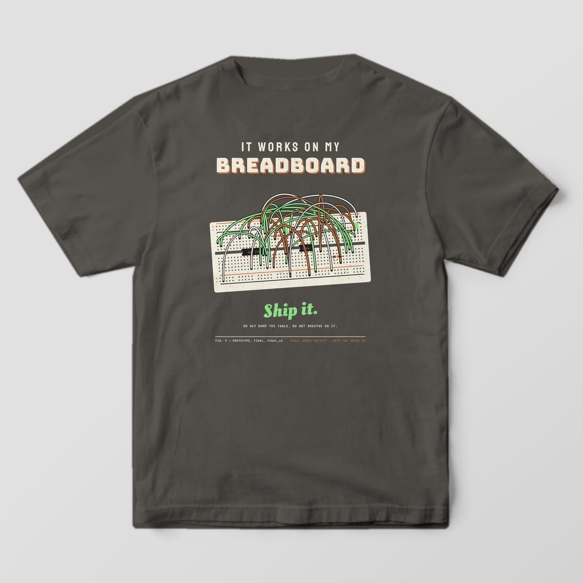 Back of a pepper Comfort Colors 1717 tee with a breadboard and jumper wire spaghetti print and Ship It script.