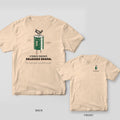 Ivory tee shown back and front: back has a green capacitor with smoke rising from it over Stores Energy. Releases Drama.; front has a small capacitor.
