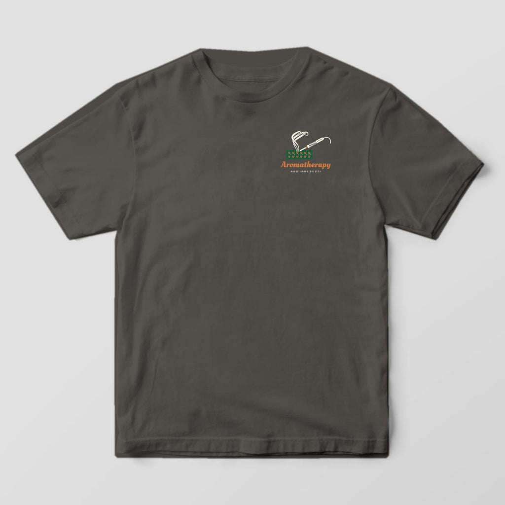 Front of a pepper Comfort Colors 1717 tee with a small soldering iron, circuit board and Aromatherapy script on the left chest.