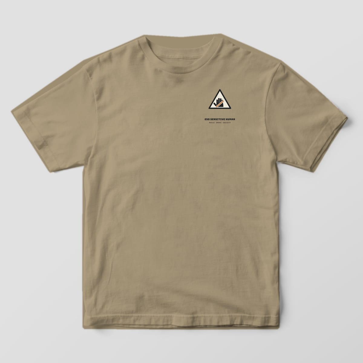 Front of a khaki Comfort Colors 1717 tee with a small ESD warning triangle on the left chest.