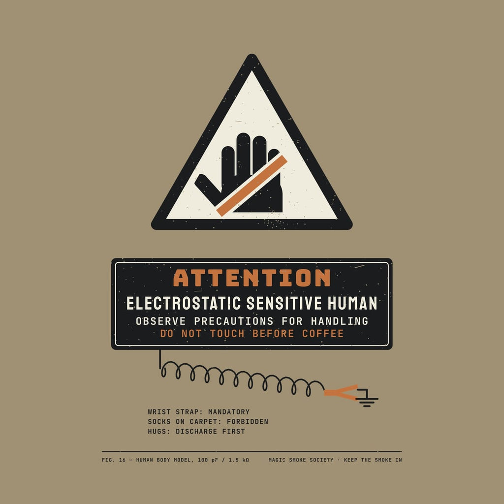 Close-up of the warning artwork showing the hand symbol, the Do Not Touch Before Coffee line and the grounded wrist strap.
