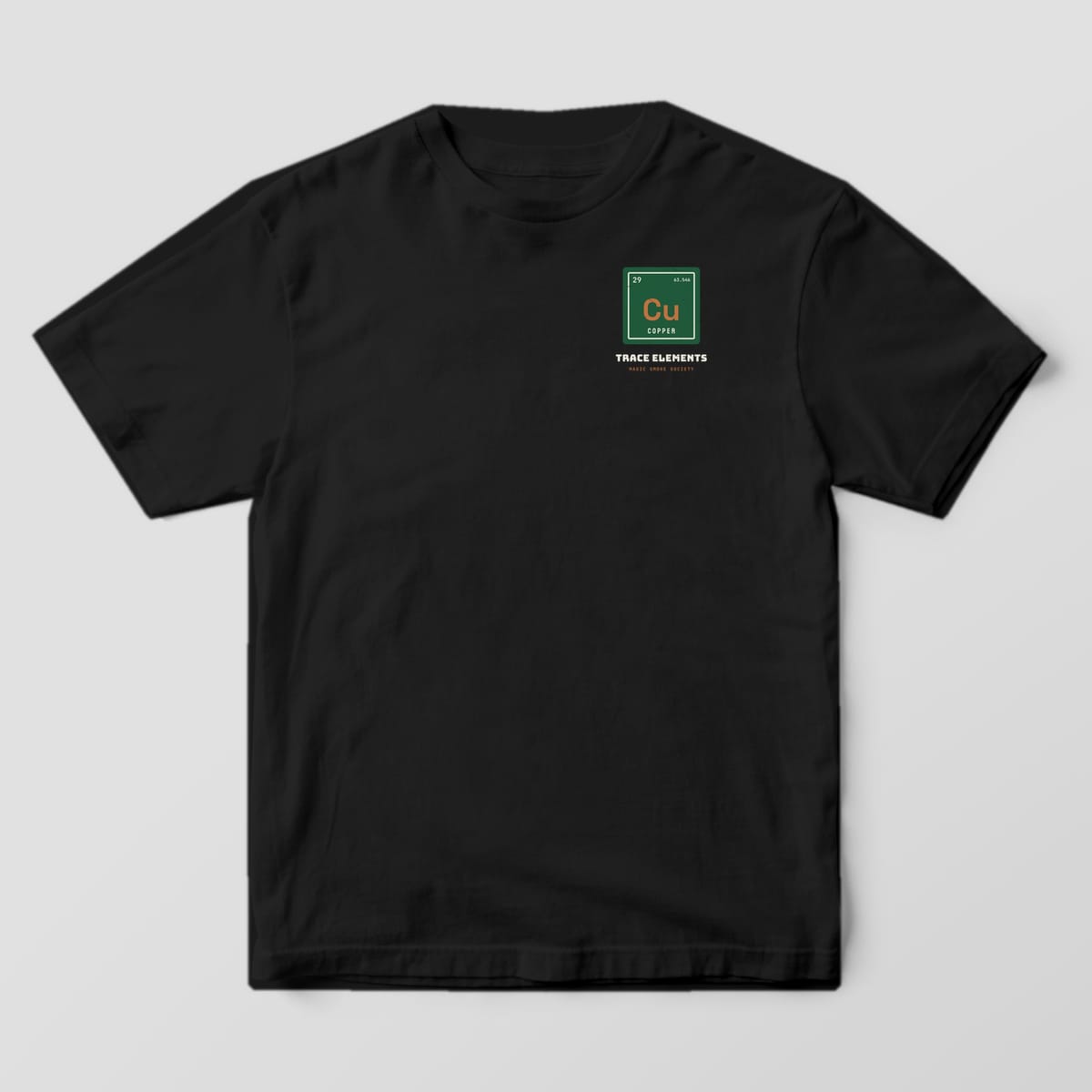 Front of a black Comfort Colors 1717 tee with a small green Cu periodic tile on the left chest.