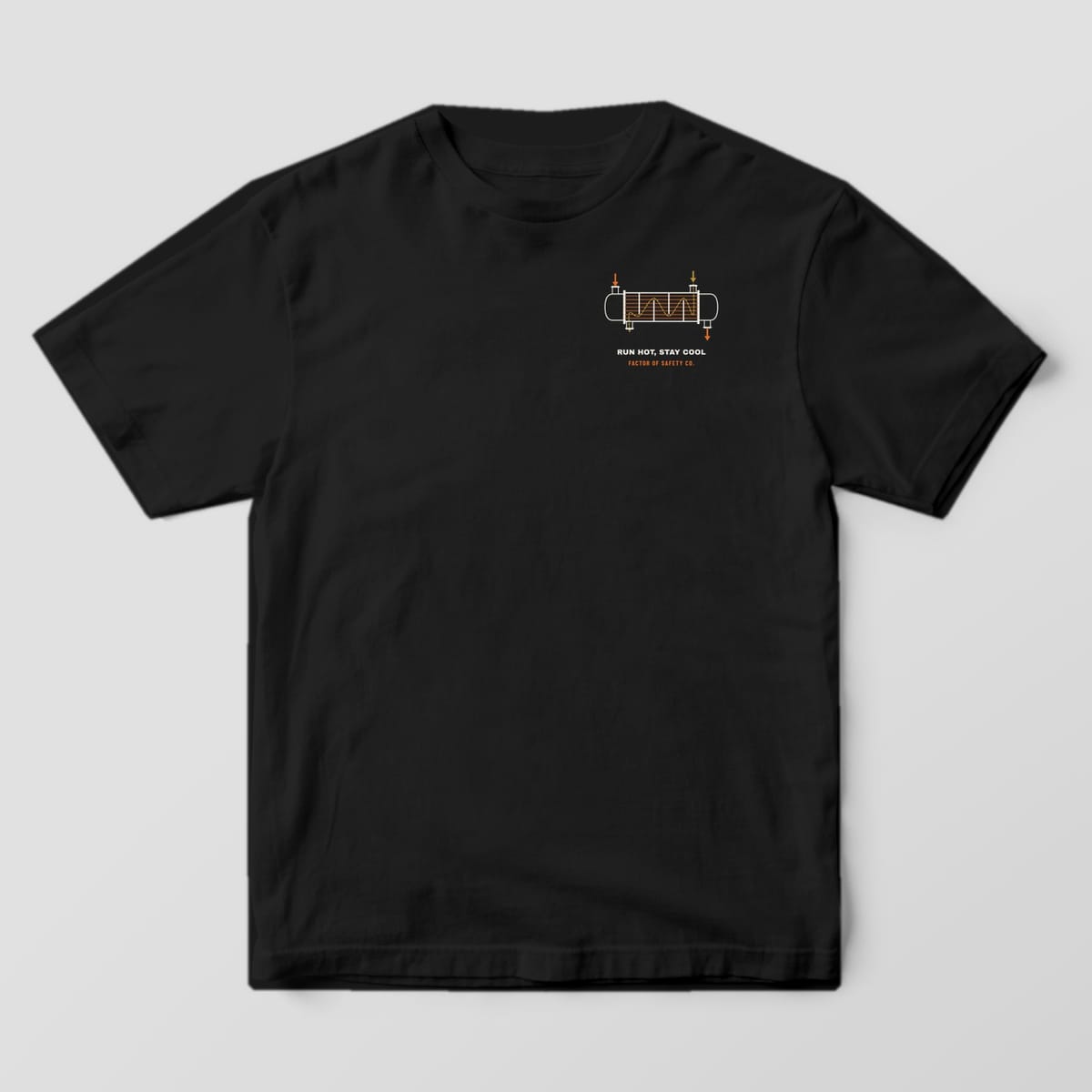 Front of a black Comfort Colors 1717 tee with a small heat exchanger cutaway on the left chest.