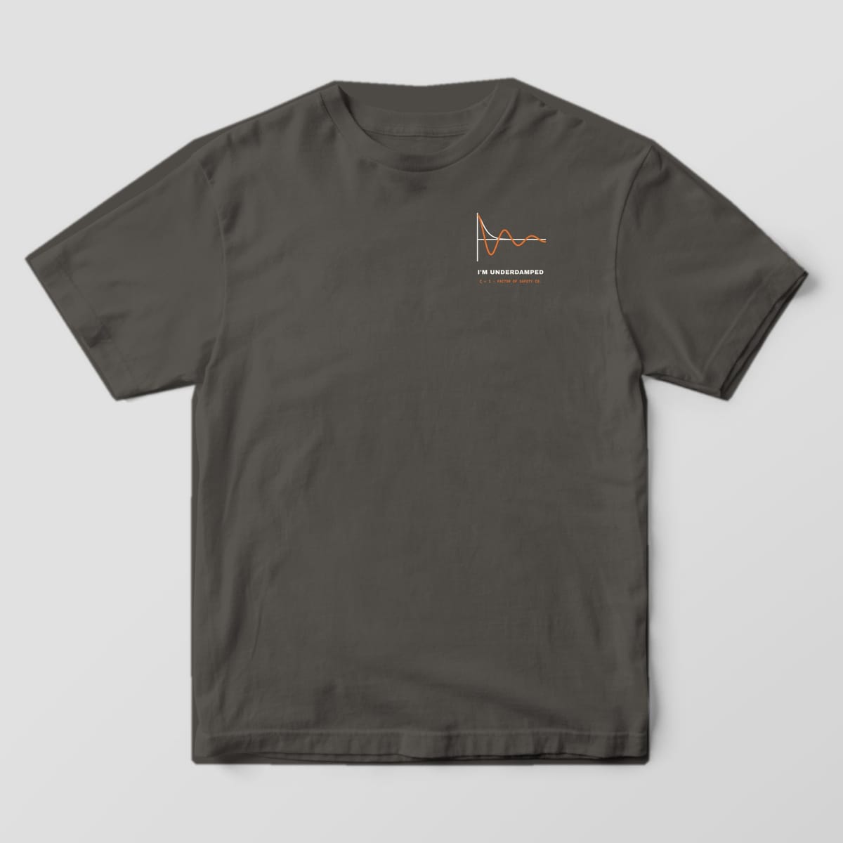Front of a pepper Comfort Colors 1717 tee with a small underdamped response curve on the left chest.