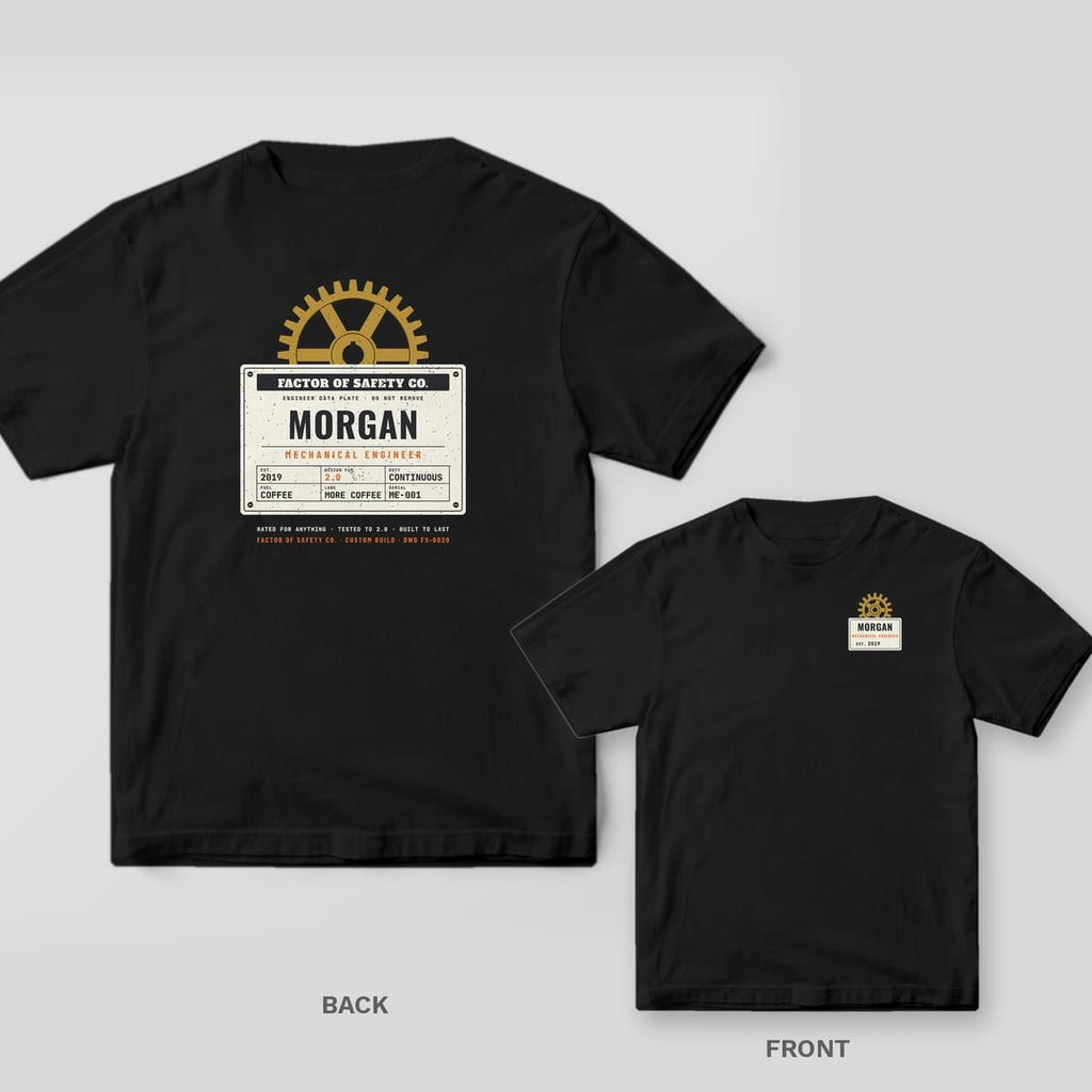Black tee shown back and front: the back has a cream riveted data plate with a personalized name under a brass gear; the front has a small personalized data plate with a brass gear on the left chest.