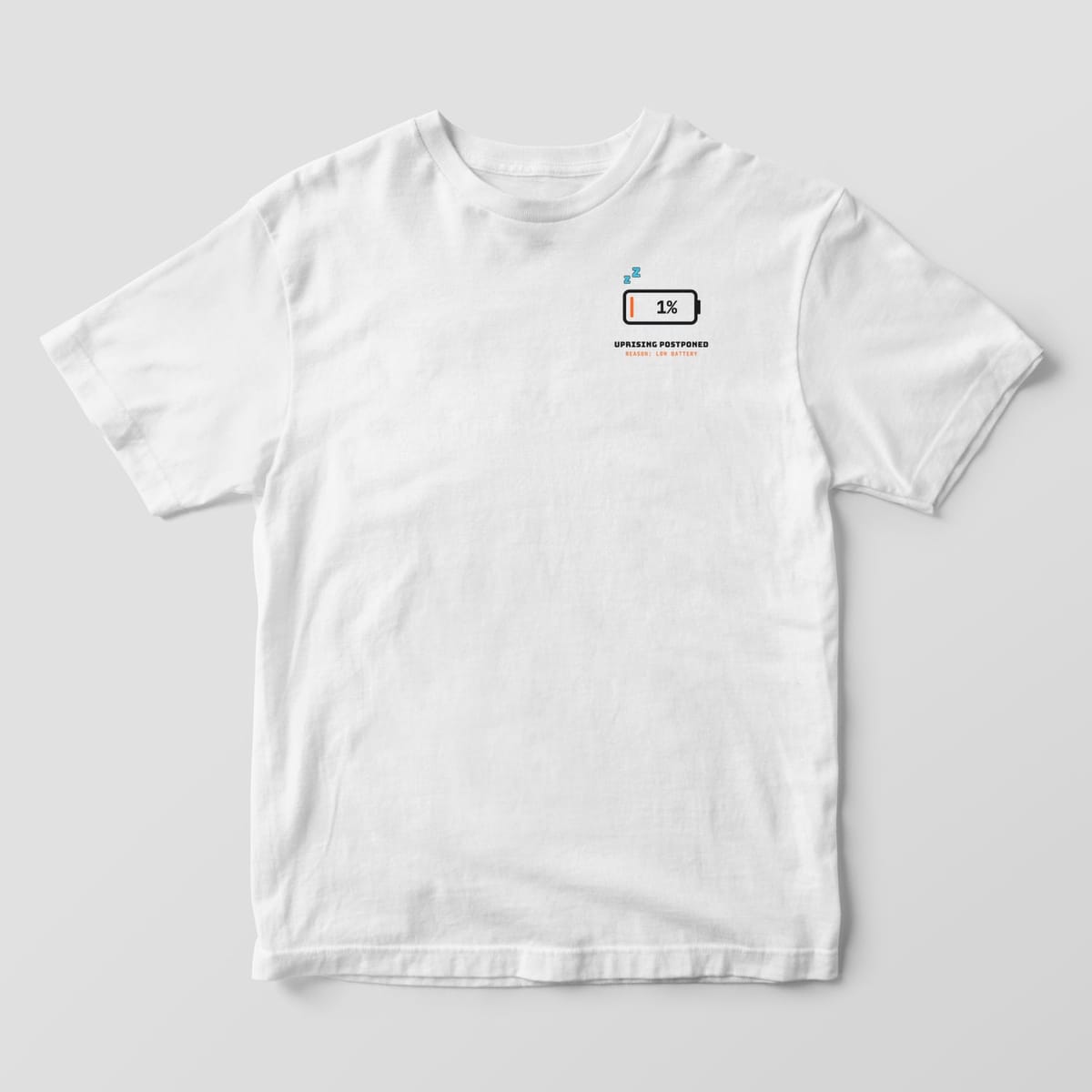 Front of a white Comfort Colors 1717 tee with a small 1% battery icon with Zz on the left chest.